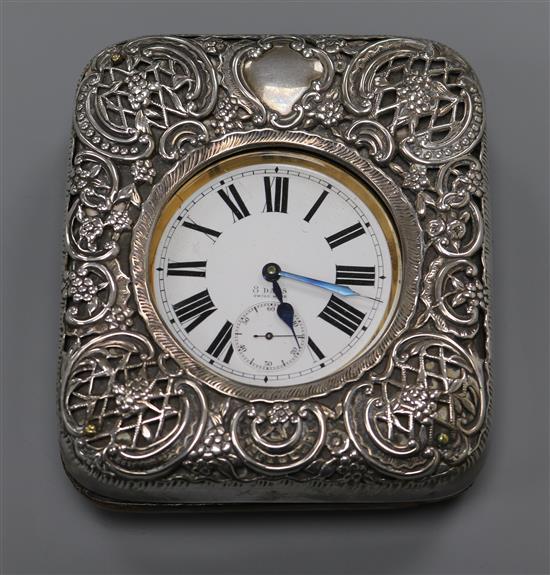 An Edwardian travelling Goliath pocket watch in repousse silver mounted travelling case, William Comyns, London, 1904, case 0cm.